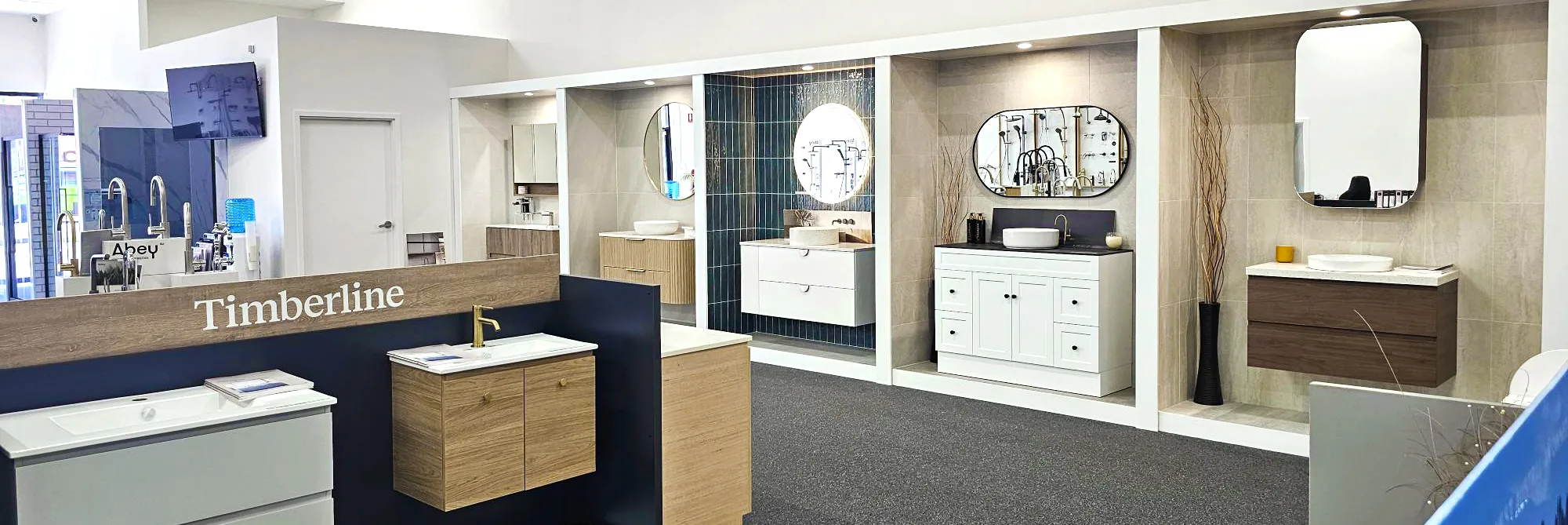 Wide view of the Osborne Park showroom floor with vanity display bays and tiled walls