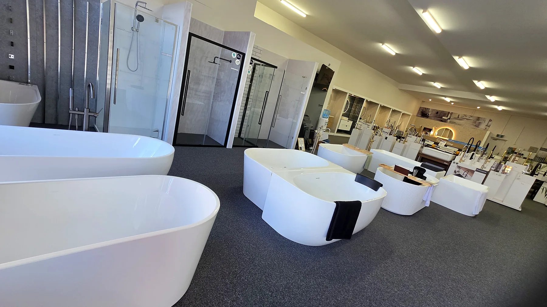 The Renovation Centre showroom floor at Osborne Park, with freestanding baths, shower screens and vanity displays