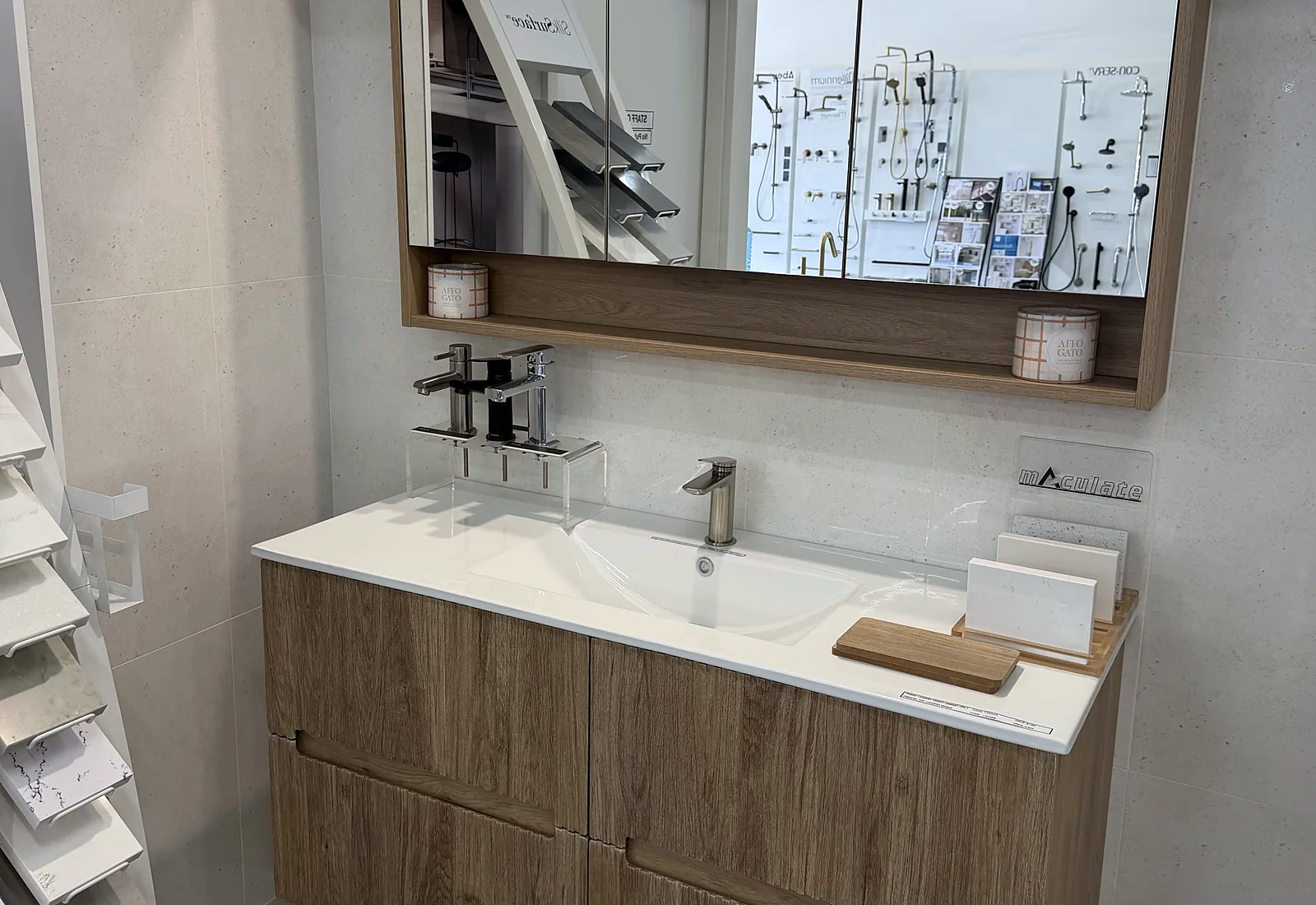 Timber wall hung vanity with a moulded double basin and a timber framed mirror cabinet in the Osborne Park showroom