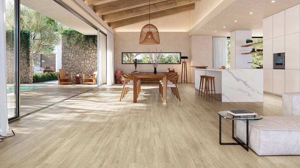 Stoneworld Pinewood timber-look porcelain plank tiles running from a kitchen out to an alfresco area