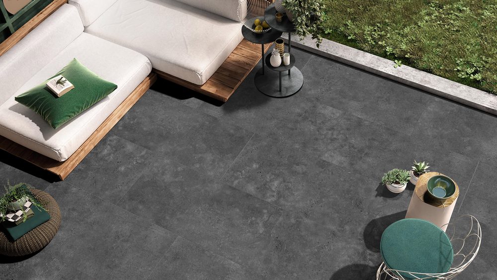 Stoneworld Kross charcoal SmoothGrip slip-resistant porcelain pavers on an outdoor terrace