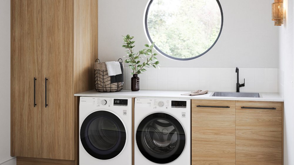 Timberline modular laundry in Prime Oak with a tall cupboard, benchtop and round window