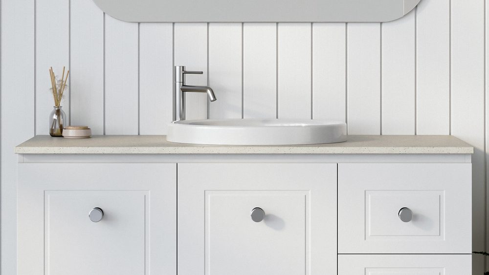 A Timberline SilkSurface vanity top with an inset basin on a white shaker vanity