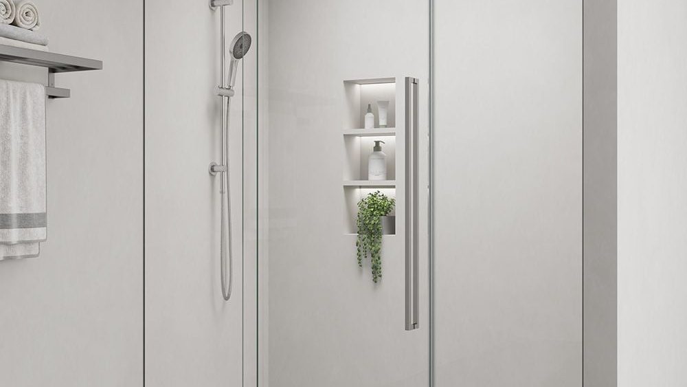 Alpine frameless glass shower screen in a tiled bathroom