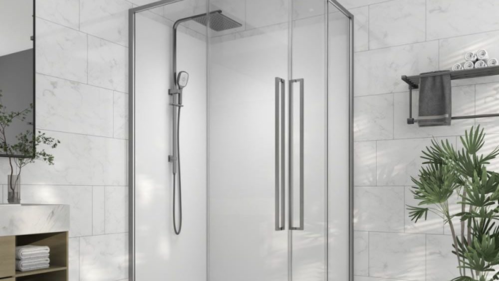 Alpine corner shower with acrylic base and glass screen in a patterned tiled bathroom