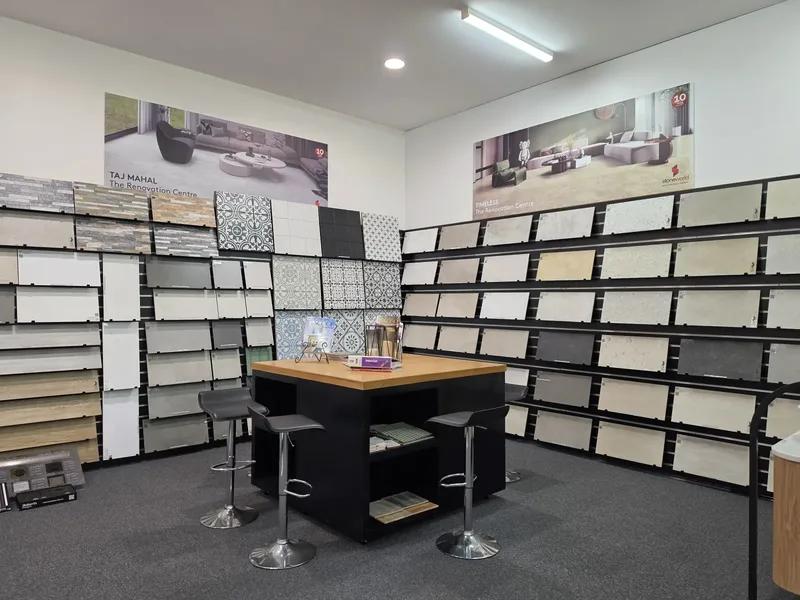 The tile selection room at the Osborne Park showroom, with Stoneworld Taj Mahal and Timeless display graphics above the tile sample racks