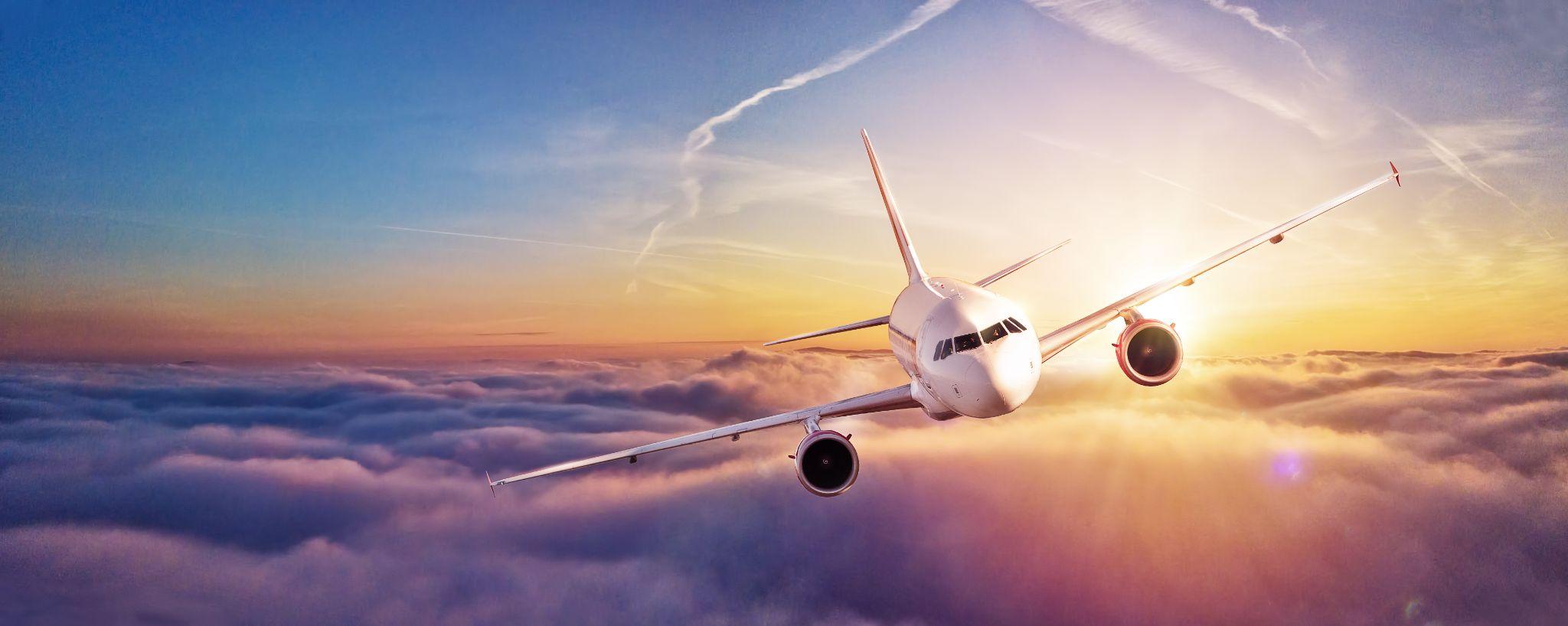 Southern Utah University Flight Management Systems case study — airliner above the clouds