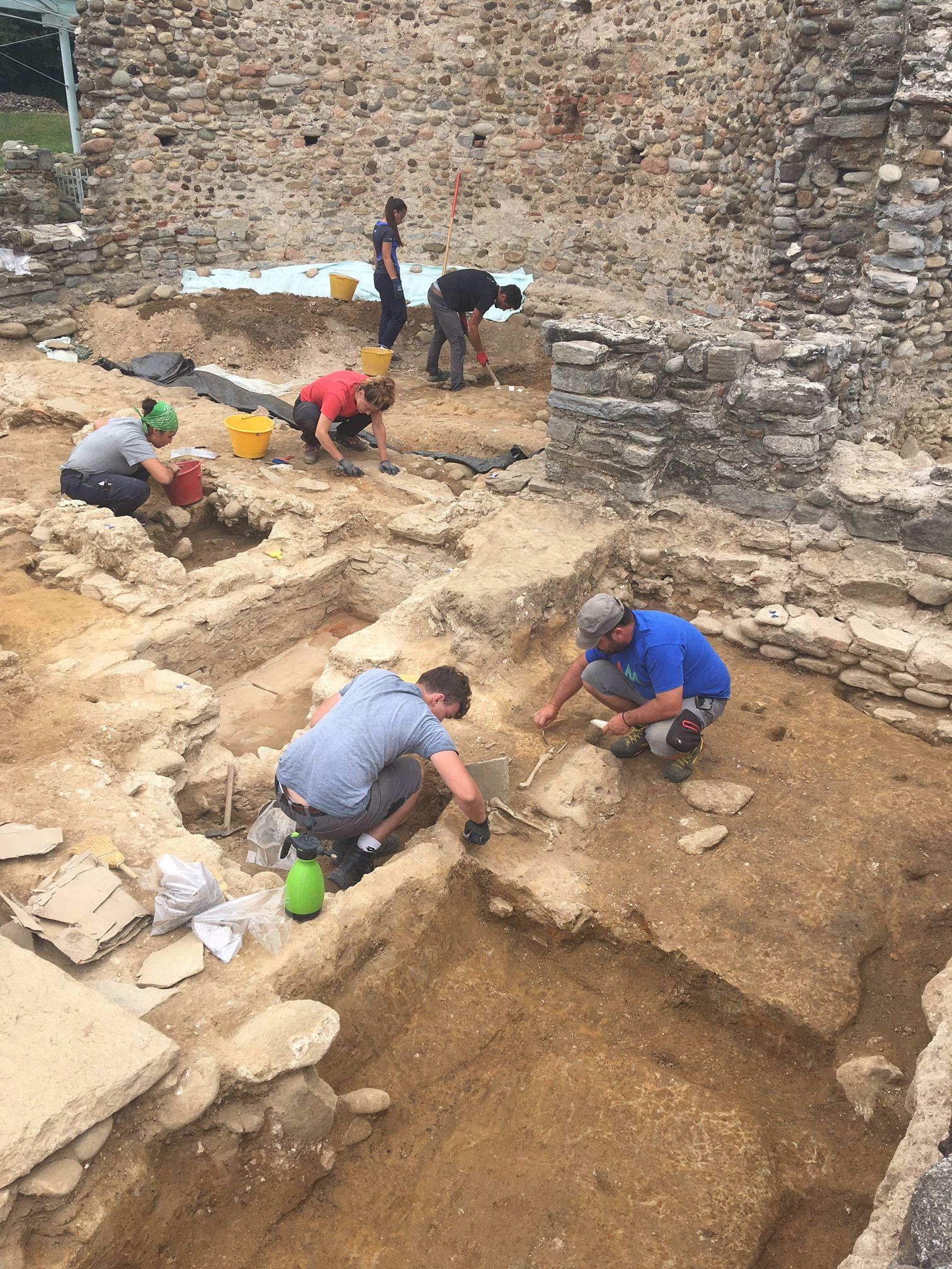 Archaeologists working at a medieval excavation site