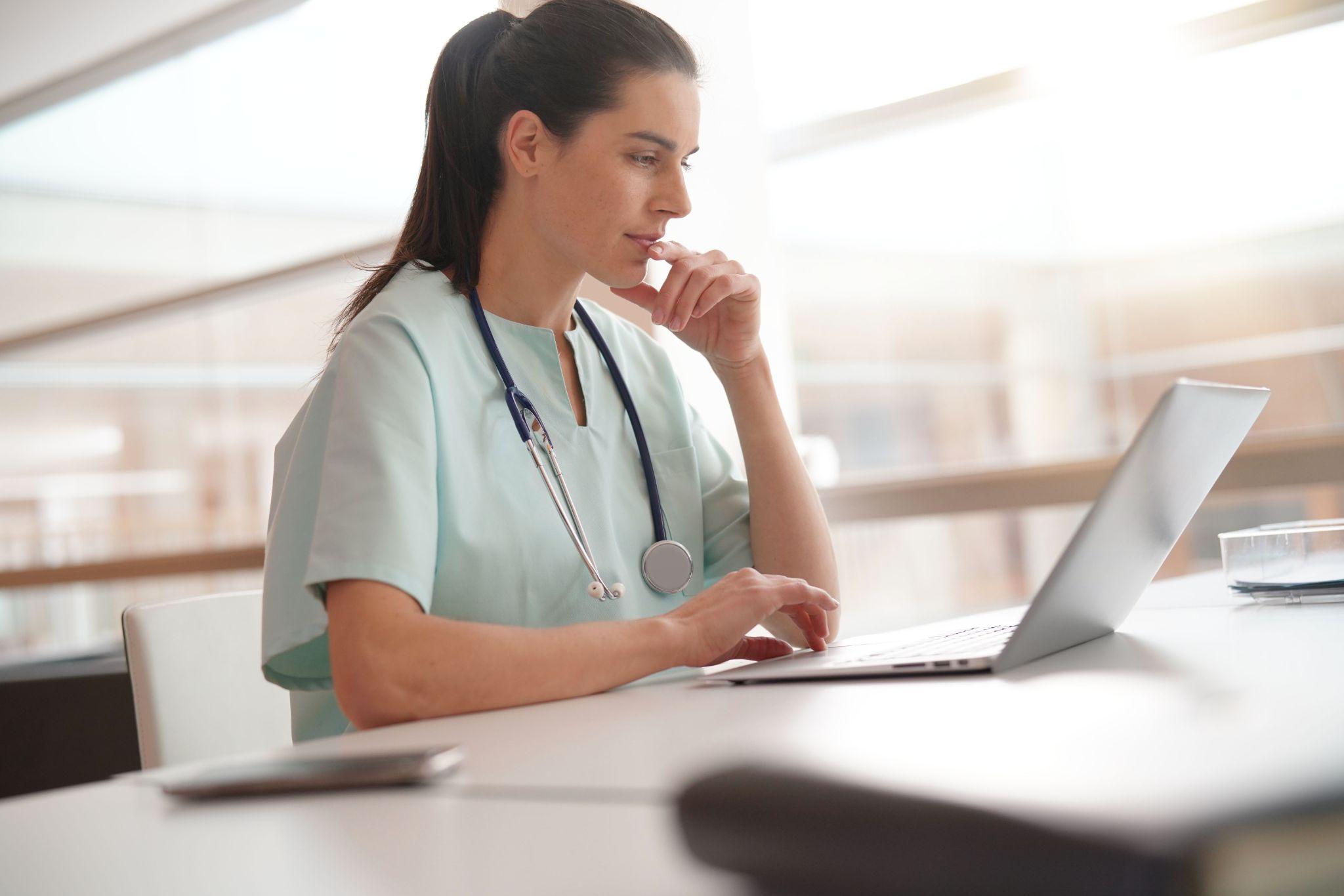 Healthcare student studying course material on a laptop
