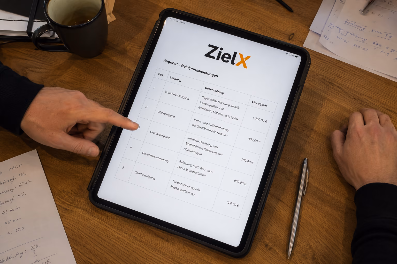 Tablet screen showing a cleaning service price list titled ZielX with hands pointing and resting beside it.