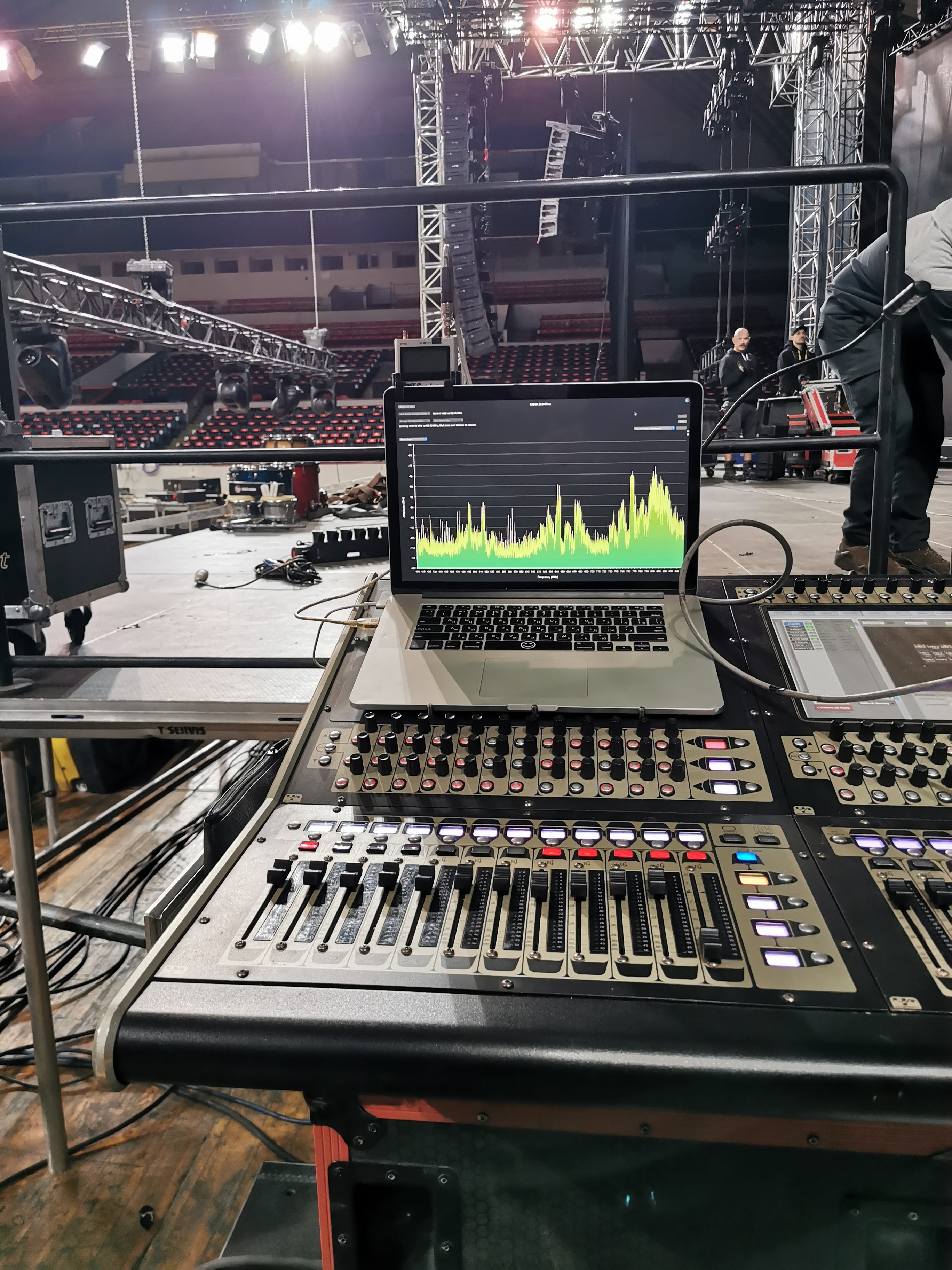 Measurement laptop and console at front of house during system tuning