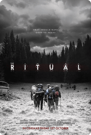 Movie poster for The Ritual showing four hikers with backpacks walking through a misty forest clearing toward dark, tall trees under a stormy gray sky, with the tagline 'They should have gone to Vegas' above the title and release date below.
