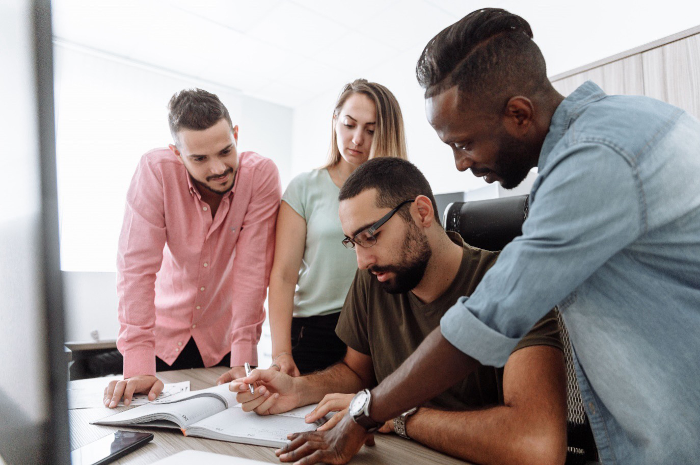 Consultants collaborating with clients during an executive search and headhunting strategy session to identify senior leadership talent.