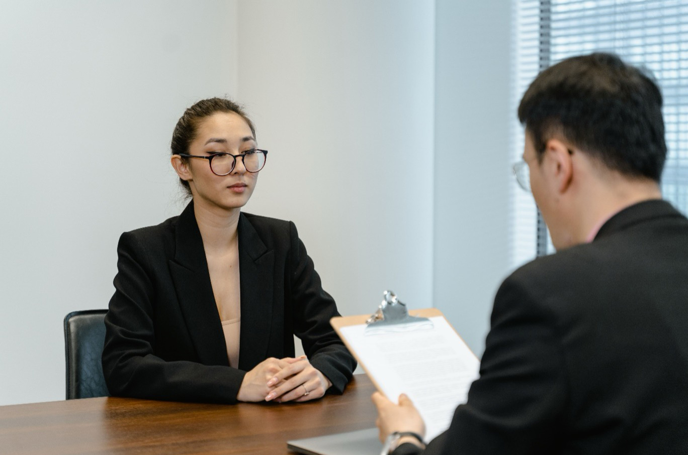 An interviewer evaluating a senior candidate during a high-stakes SCS2 executive search assessment process.