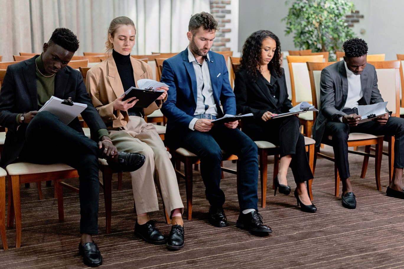 A diverse talent pool of candidates preparing for senior leadership assessments during an SCS2 executive search.