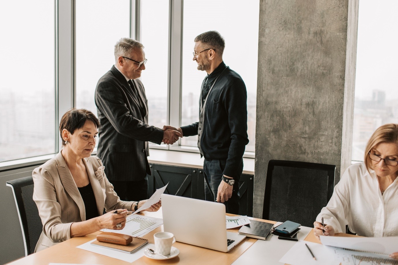 Executive compliance leads reviewing contractor documentation and status determination statements under off-payroll IR35 regulations.
