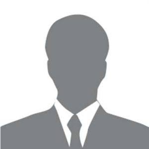 Gray silhouette of a person in a suit and tie on a white background.