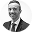 Black and white portrait of a serious man with a short beard wearing a suit and tie.