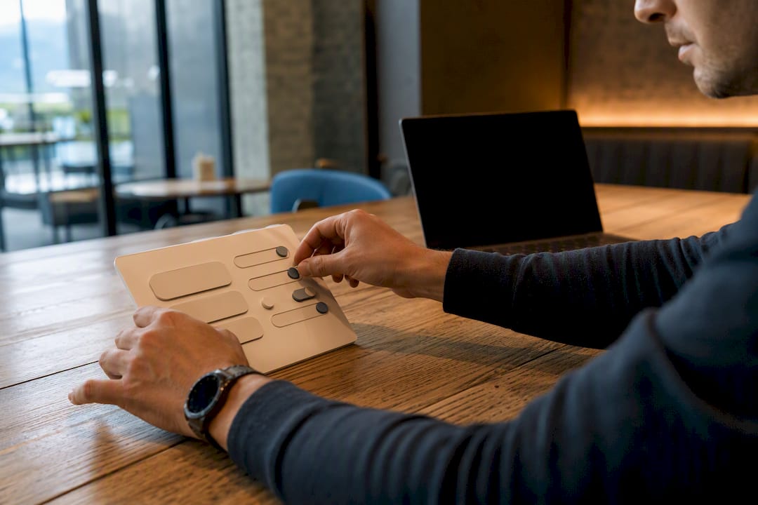 Hands adjusting cookie consent UX control panel