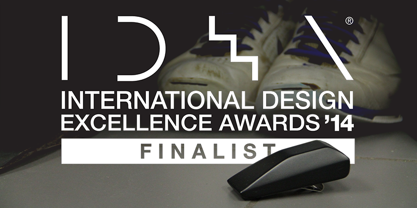International Design Excellence Awards '14 Finalist logo over a photo of white trainers and a small black moulded object