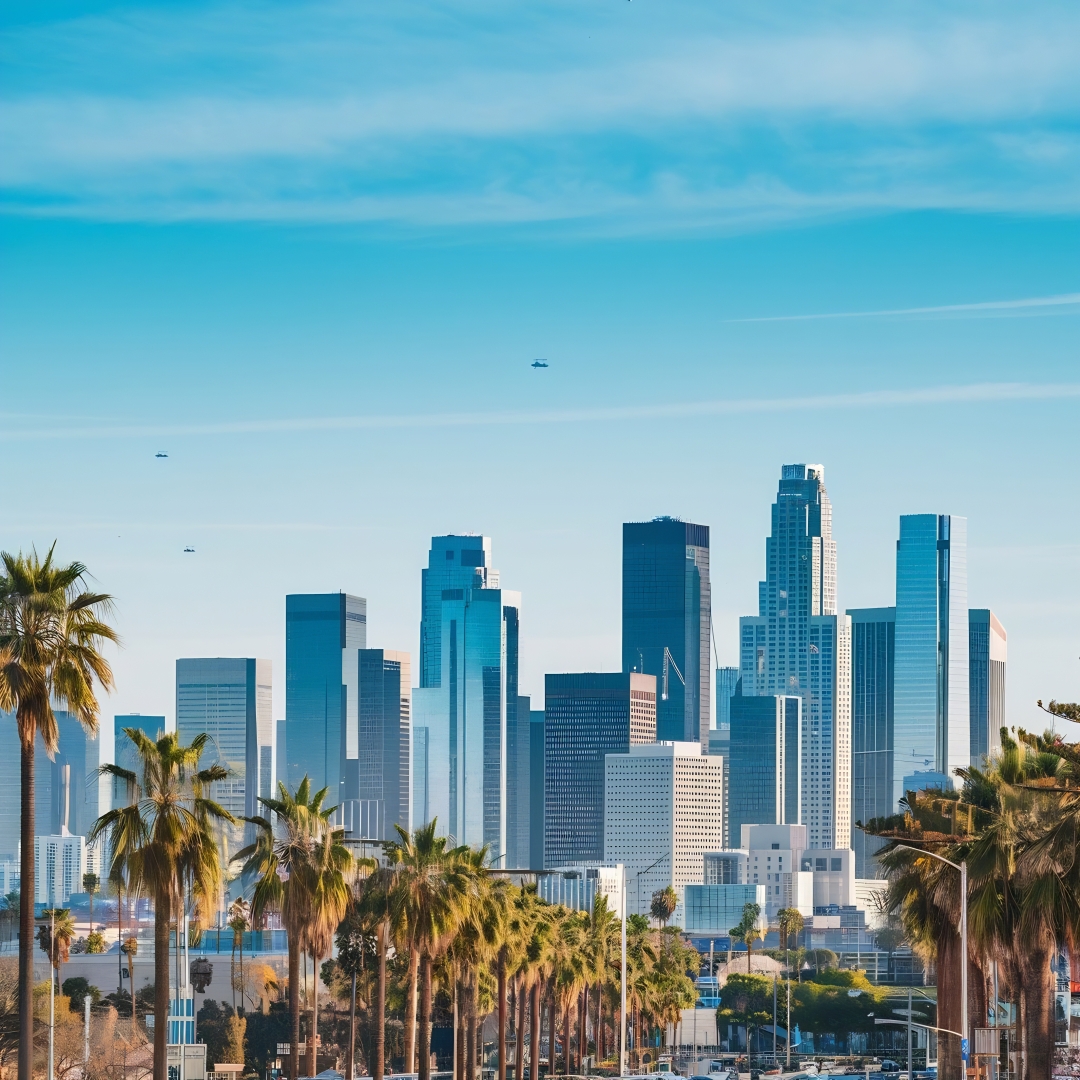 The Los Angeles skyline against a blue sky