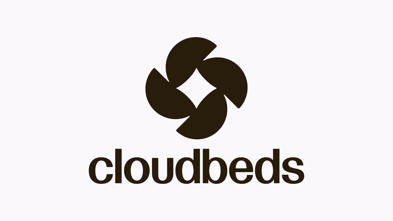 Cloudbeds logo featuring four rounded dark shapes forming a pinwheel around a diamond shape above the word 'cloudbeds' in lowercase black letters.