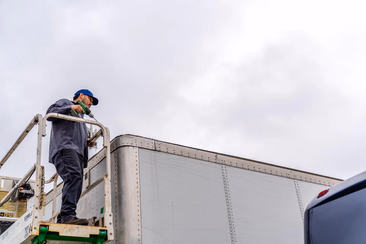 Diesel mechanic performing trailer repair services