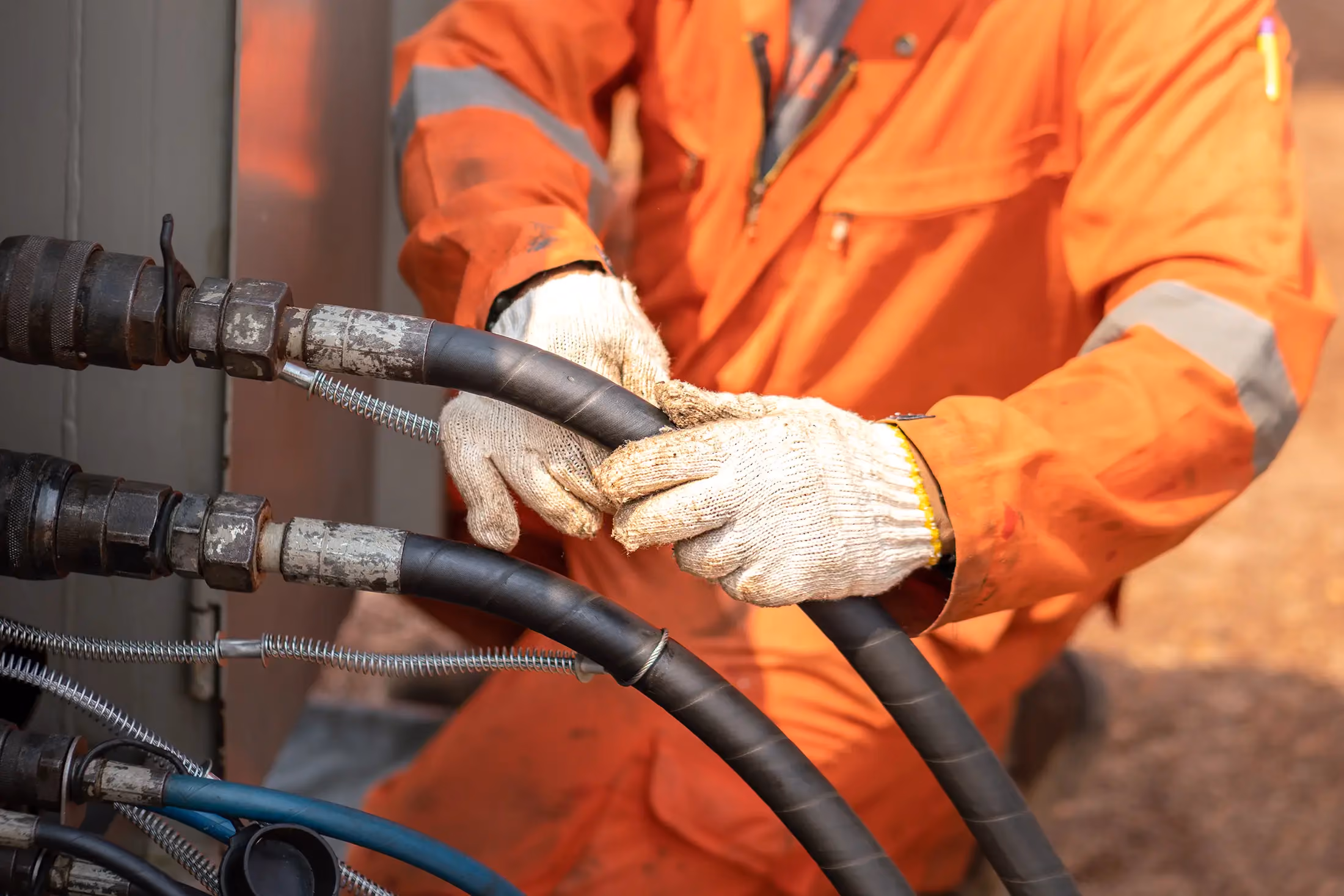 Mechanic performing hydraulic repairs