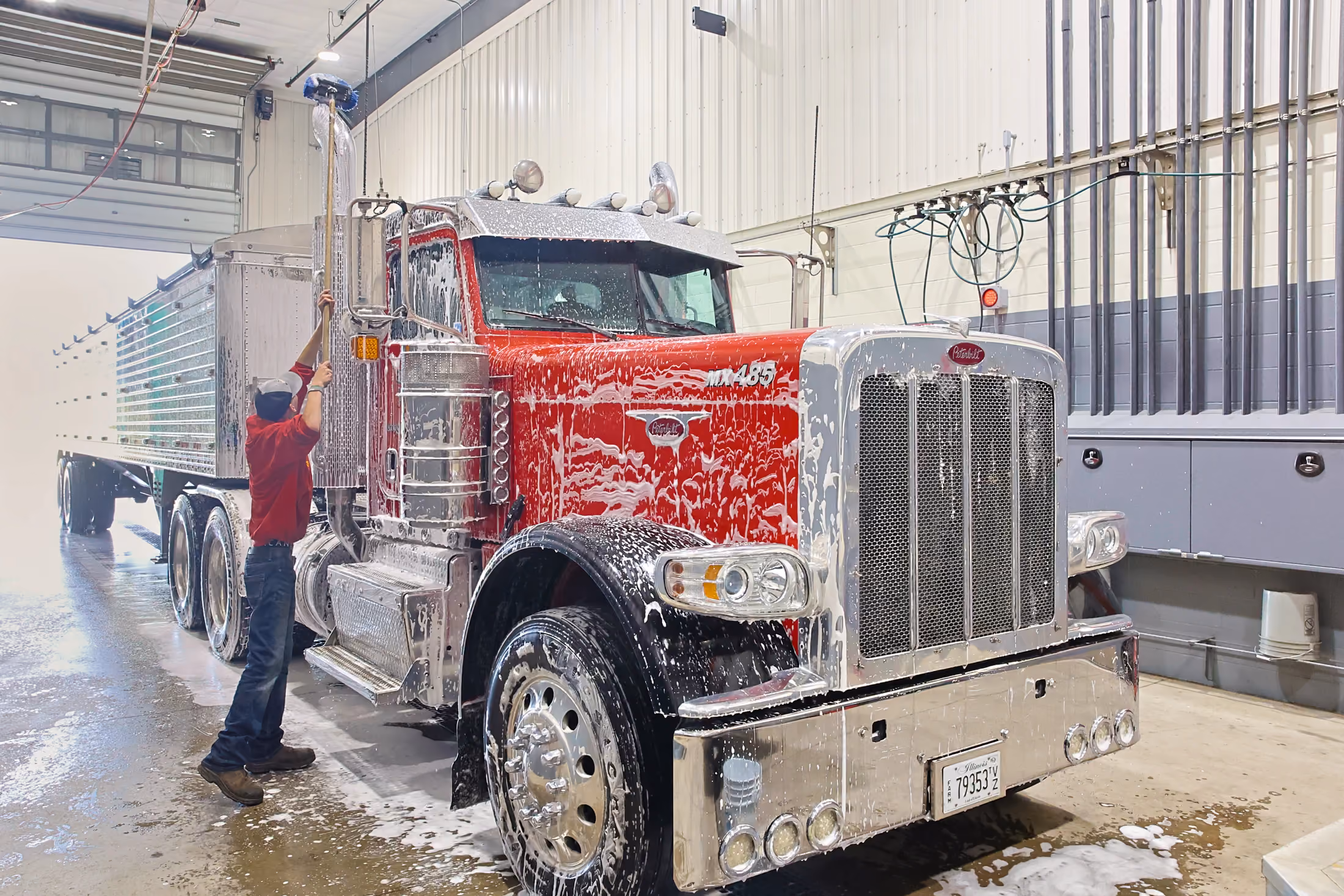 Mechanic performing heavy duty truck modifications