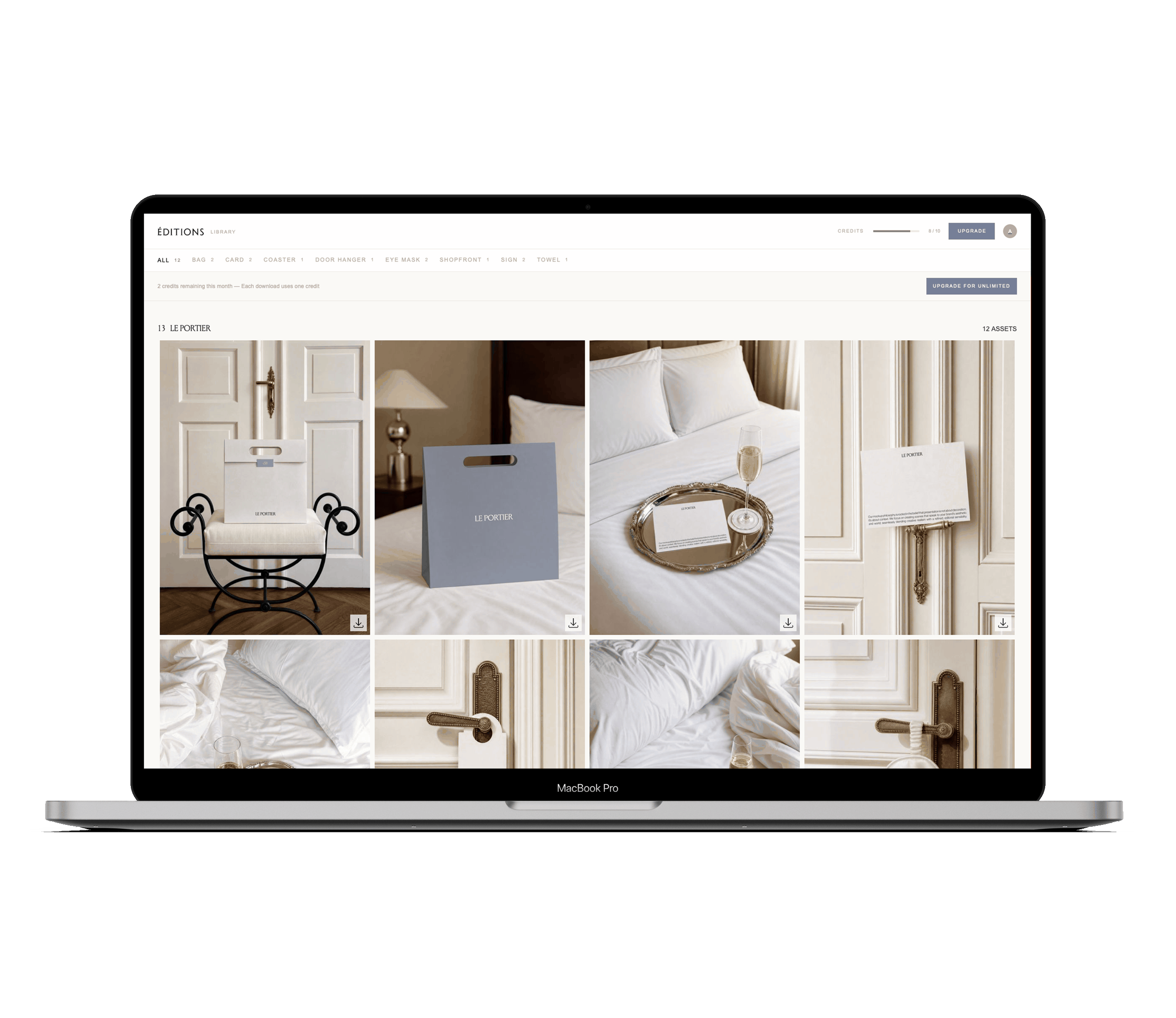 MacBook Pro laptop screen displaying a digital library interface with a collection called 'Le Portier' showing photos of elegant hotel items including branded bags, a card on a silver tray with a glass of champagne, a door hanger, and close-ups of a bed and door handle in a sophisticated, neutral-toned room.