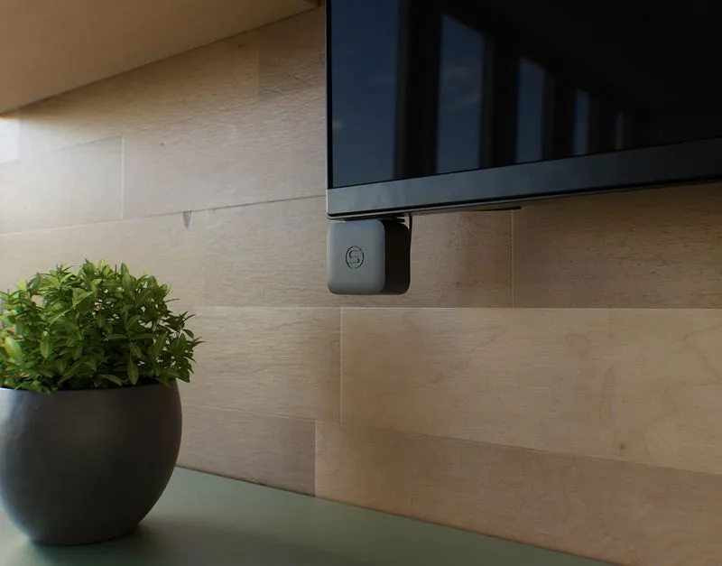 Micro sensor mounted below a conference room display