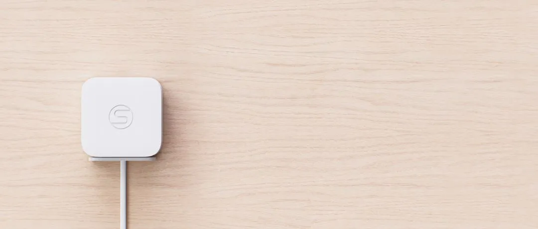 Occuspace Micro sensor mounted on a wood wall