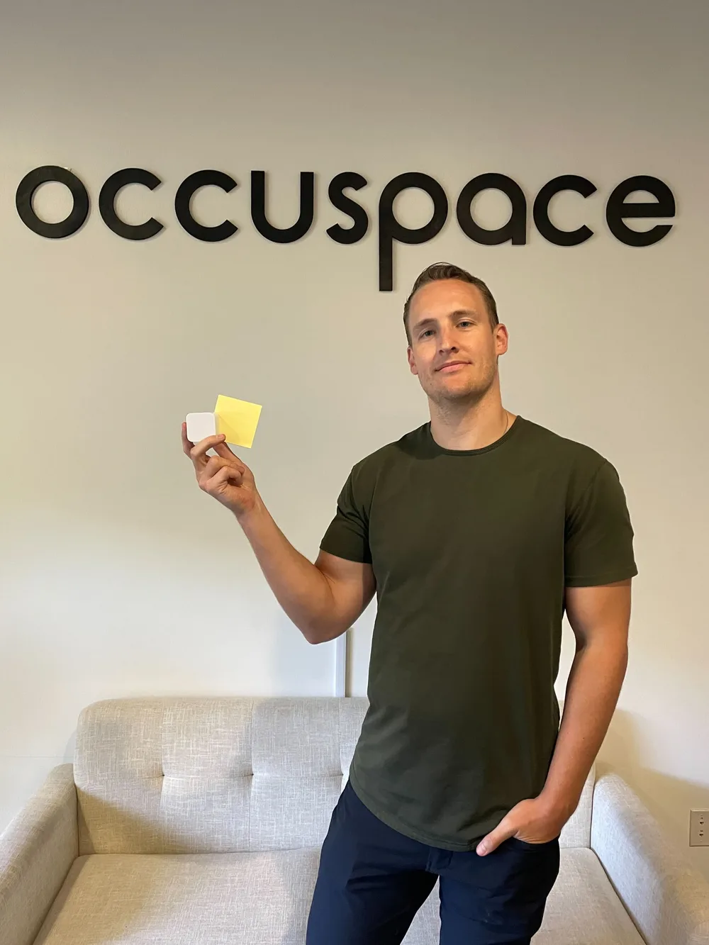 Linus Grasel, Occuspace co-founder, holding the Occuspace sensor
