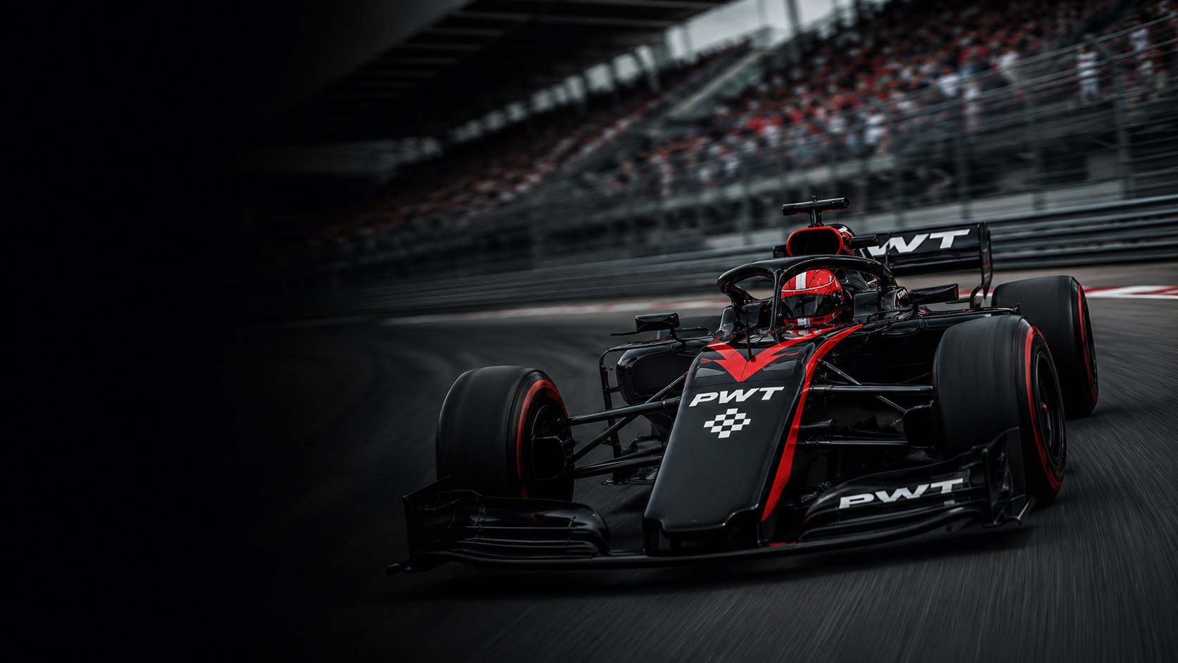 A PWT car at speed through a corner, grandstands blurred behind it.