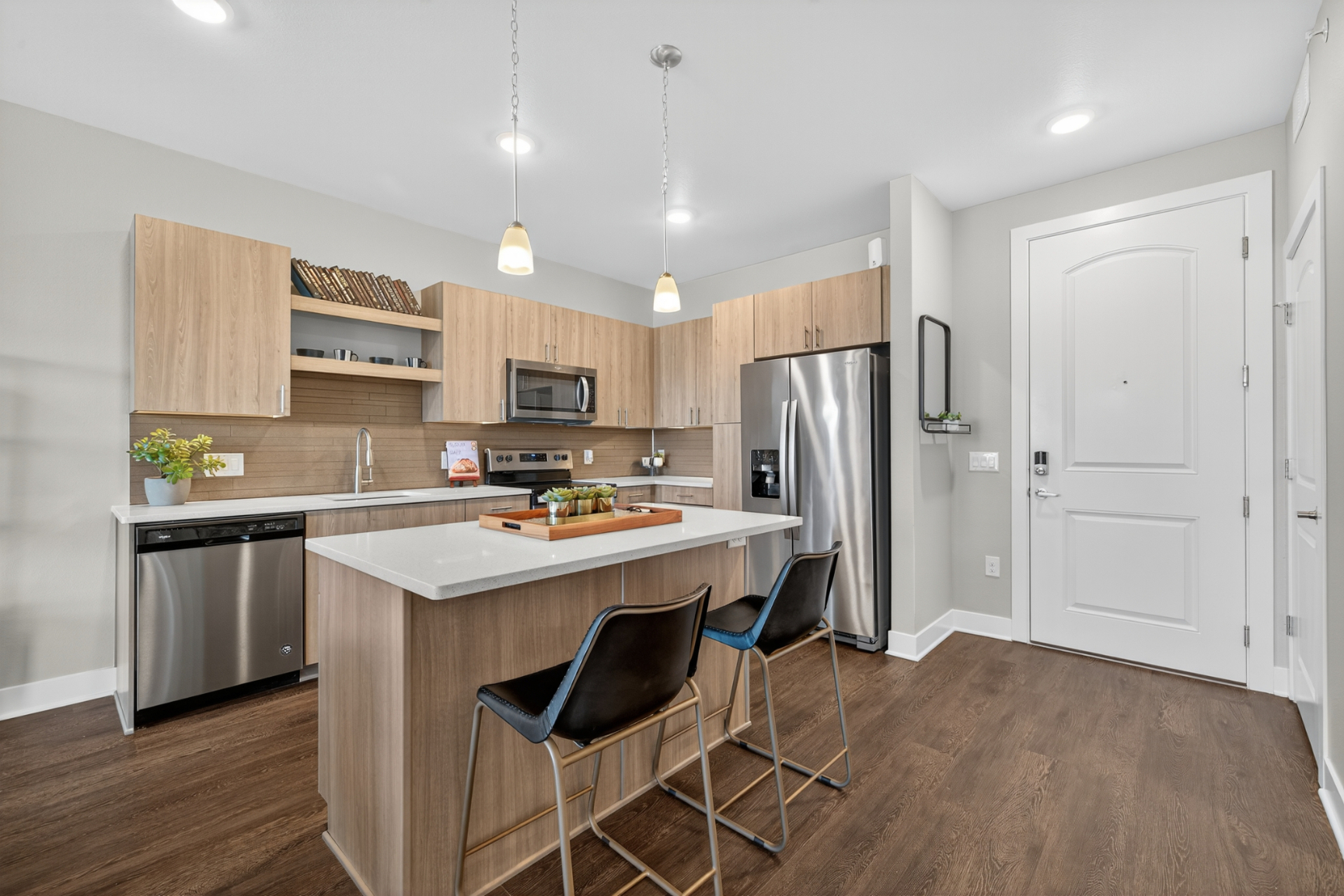 Dinning room and kitchen area with seating and decor