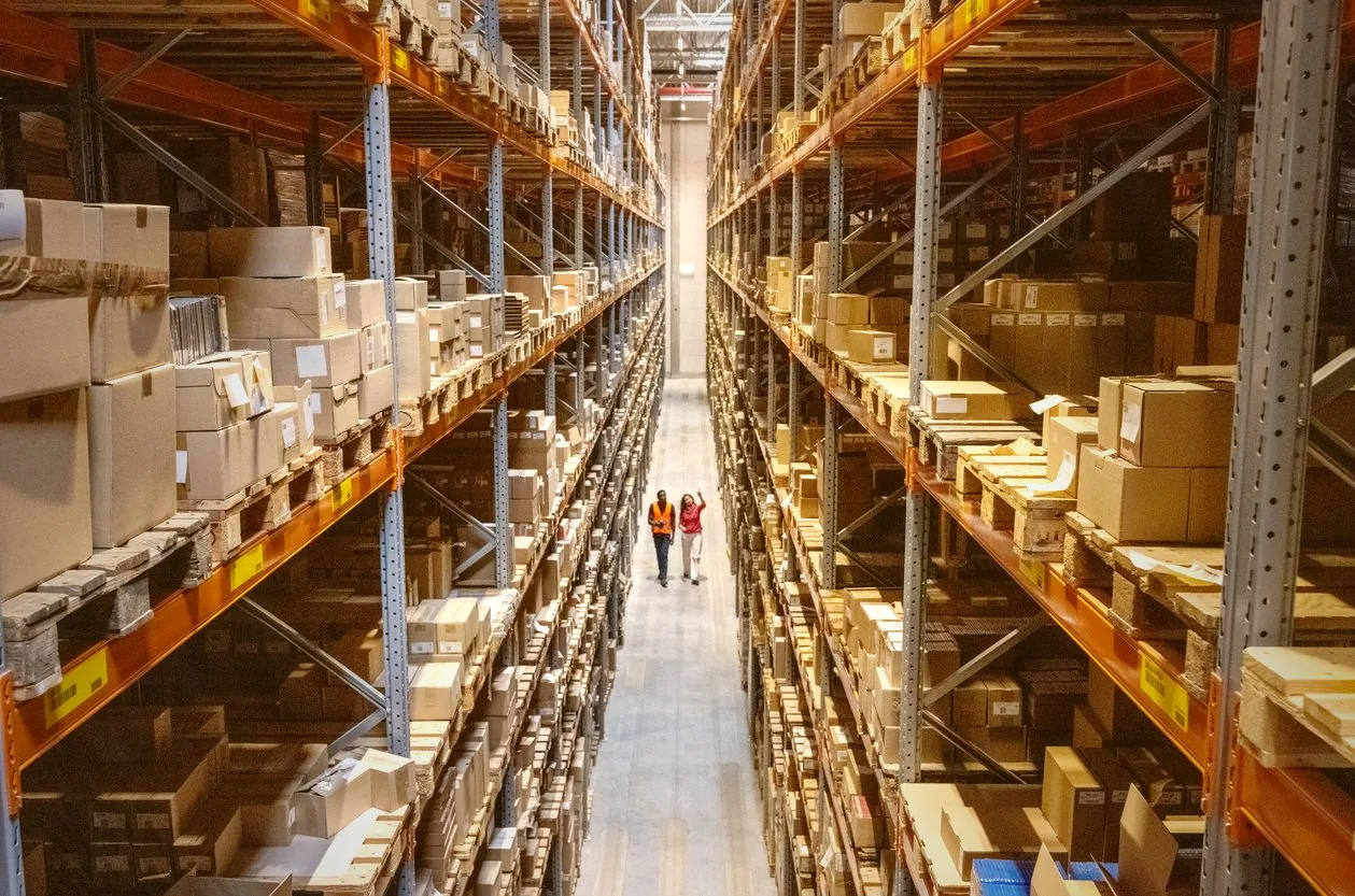Tall warehouse racking seen from the aisle floor