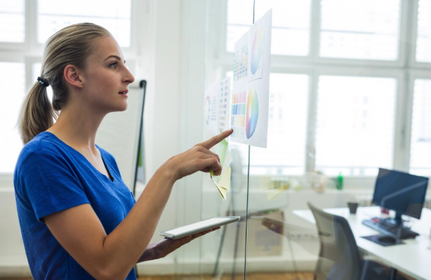 Finance professional reviewing performance charts