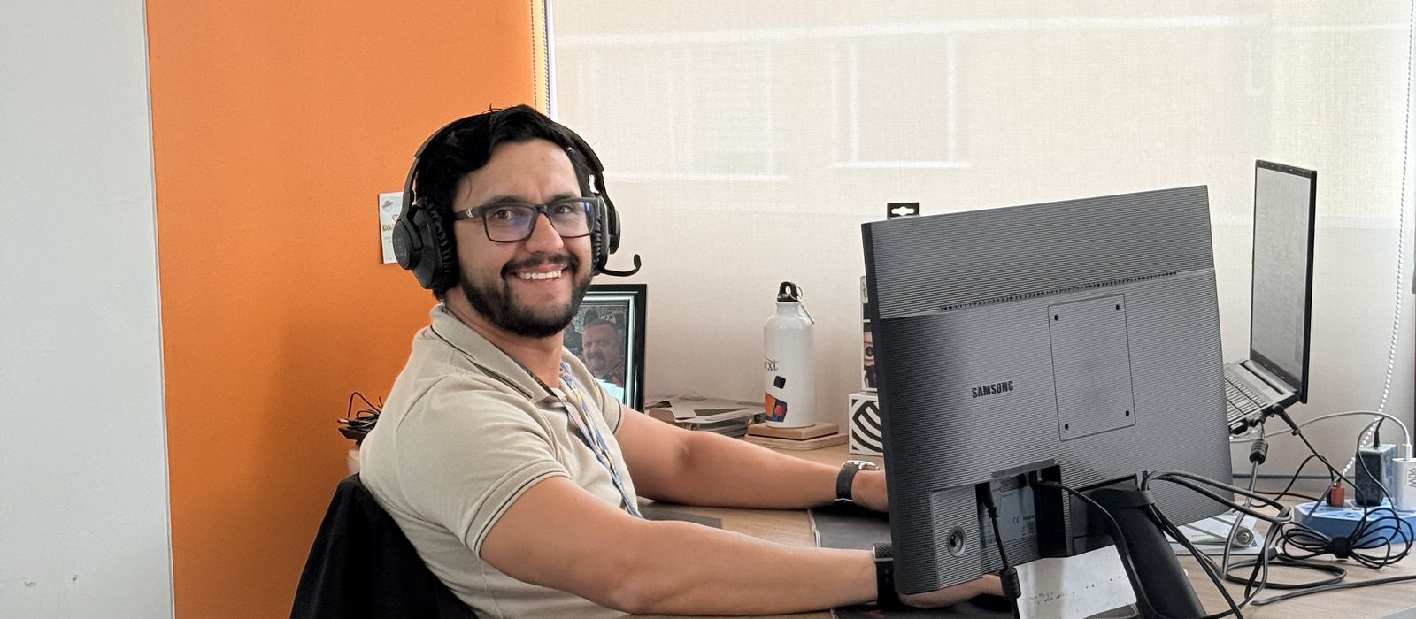A Connext team member at their desk in the delivery center