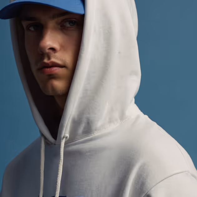 Portrait of a person wearing a white hooded sweatshirt