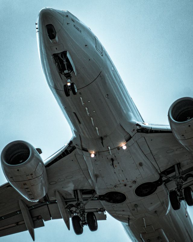 Passenger aircraft viewed from below during takeoff