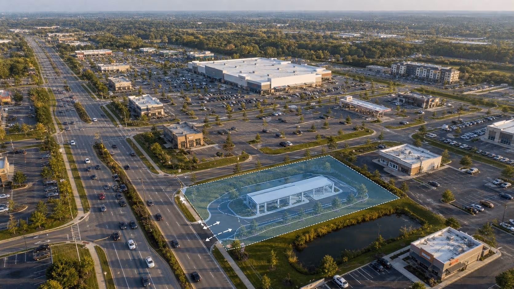 Aerial view of a commercial area with roads, parking lots, buildings, and a highlighted gas station space.