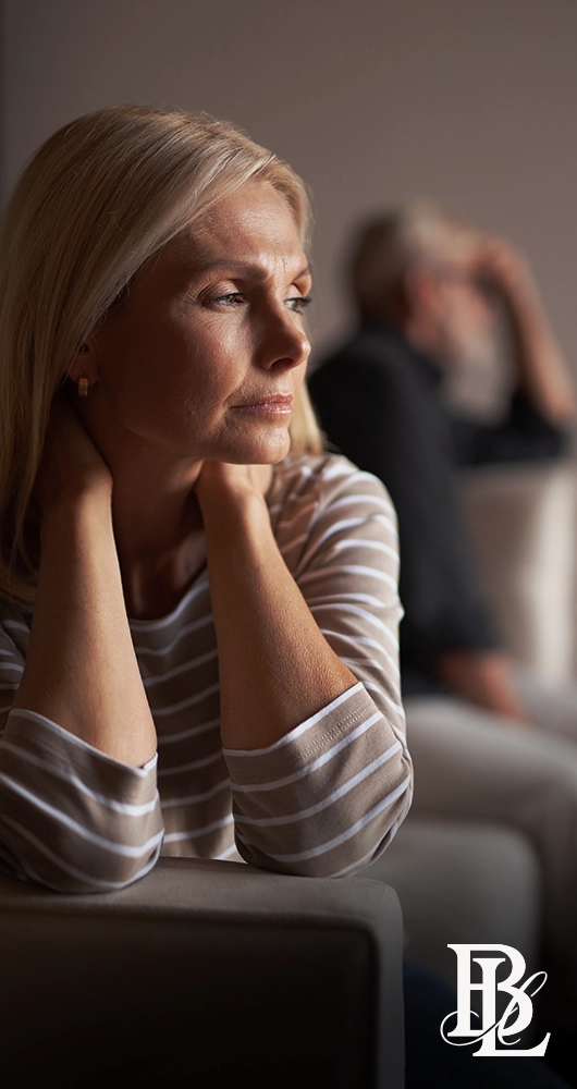 Woman reflecting on relationship and family concerns before speaking with a family law attorney