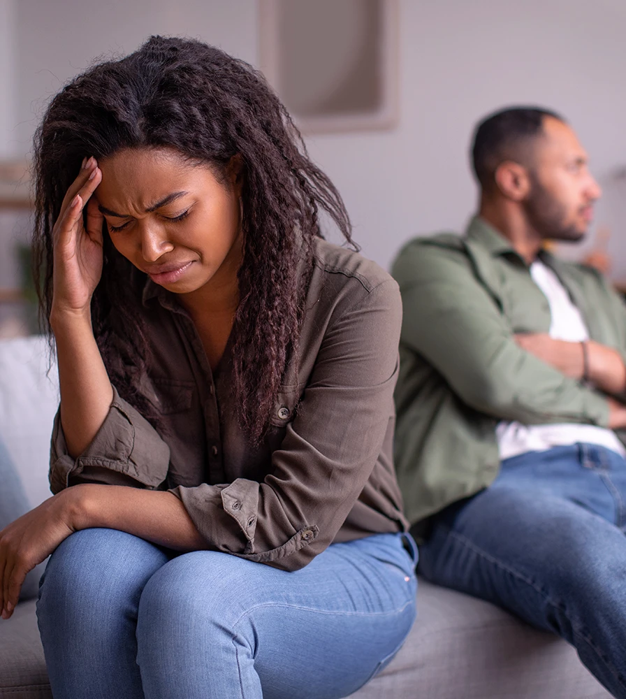 Woman feeling the financial and emotional strain of separation while considering whether to speak with an alimony attorney in Rego Park, Queens