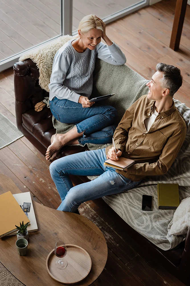 Engaged couple discussing finances and future plans before working with a prenup lawyer in Rego Park, Queens