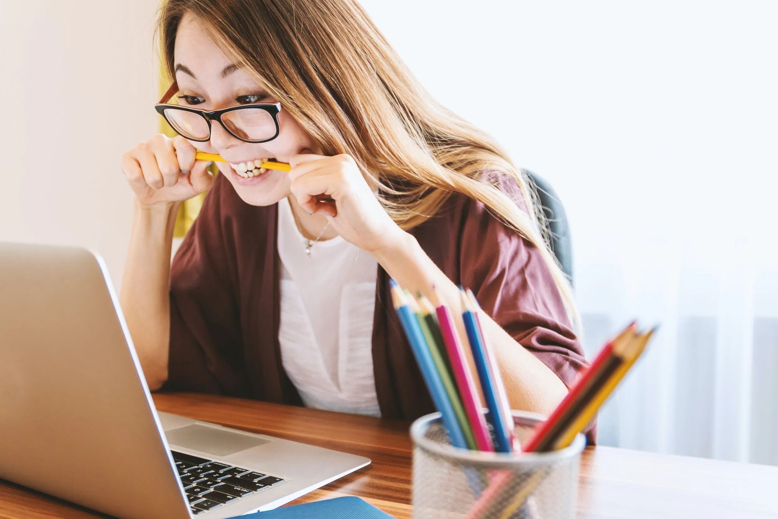 Woman looking eagerly at her computer screen