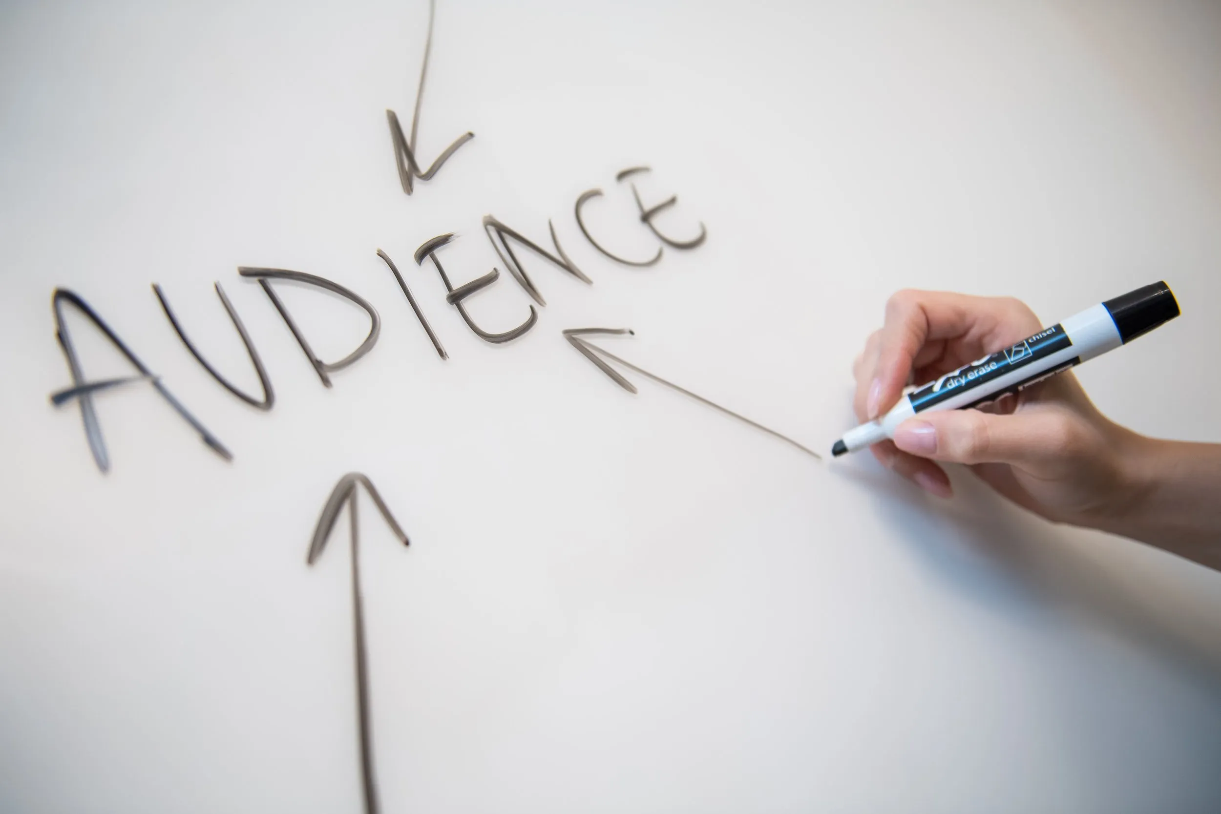 Audience written on a white board with marker