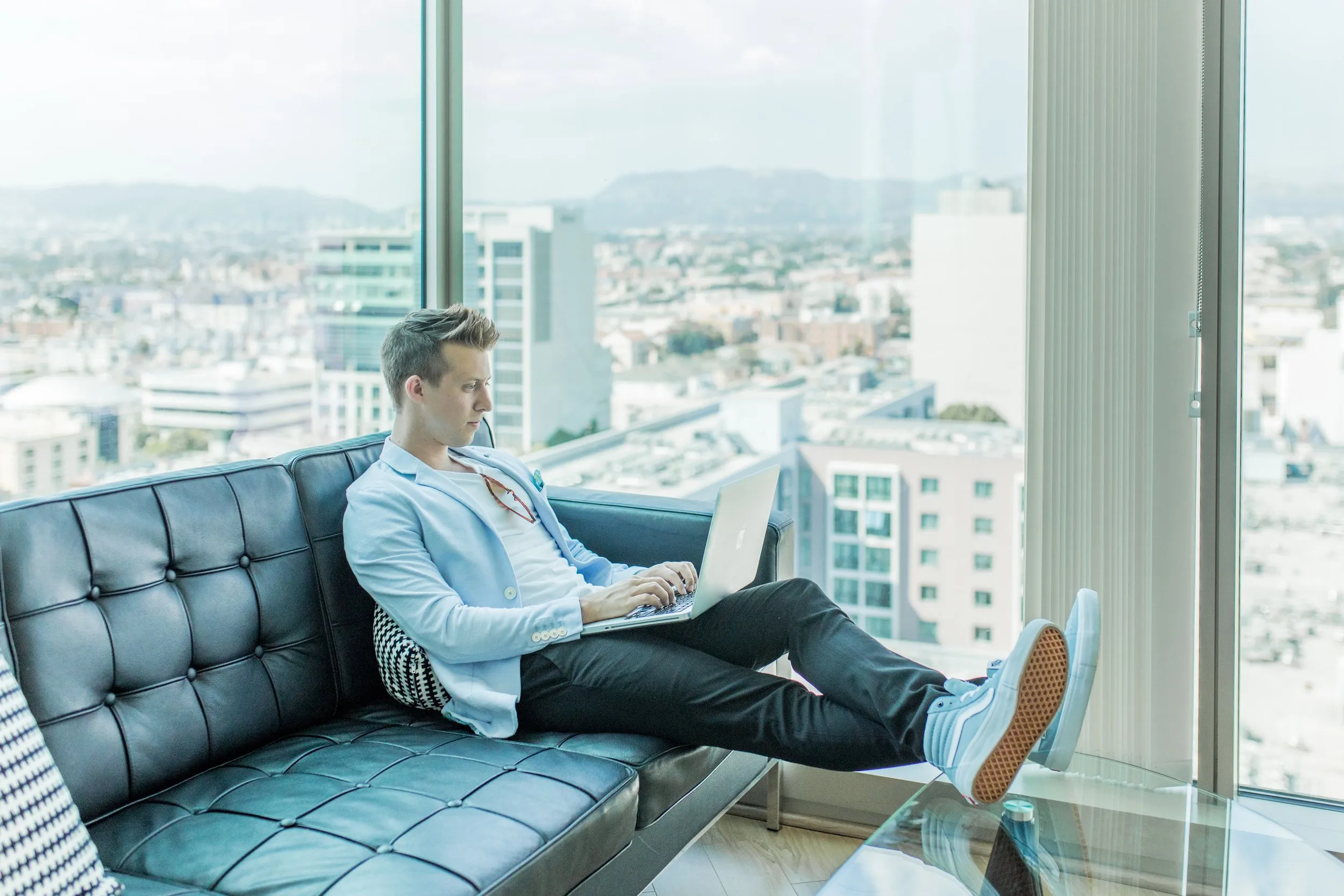 Man looking at his laptop screen doing research