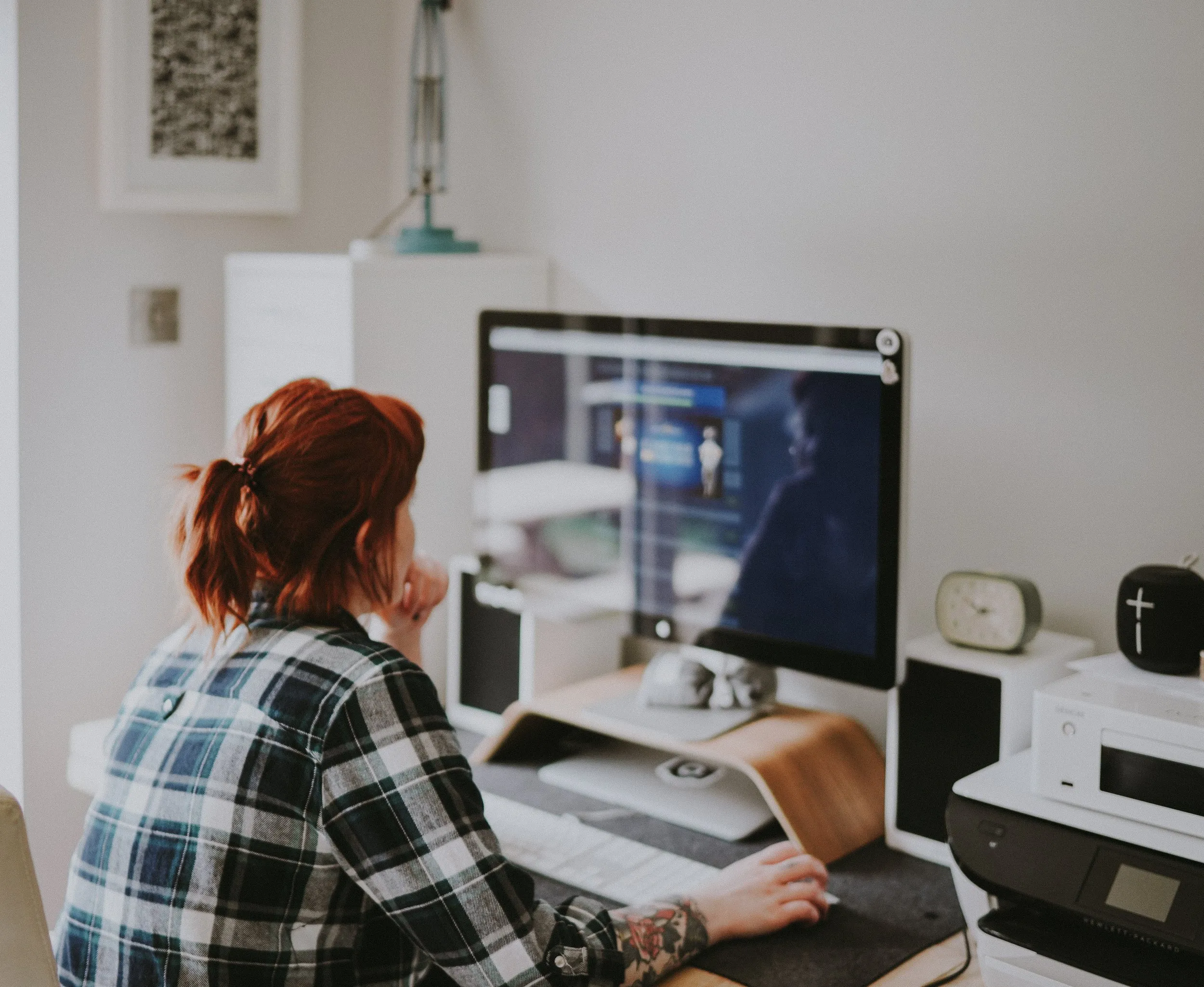 Woman at her computer desk