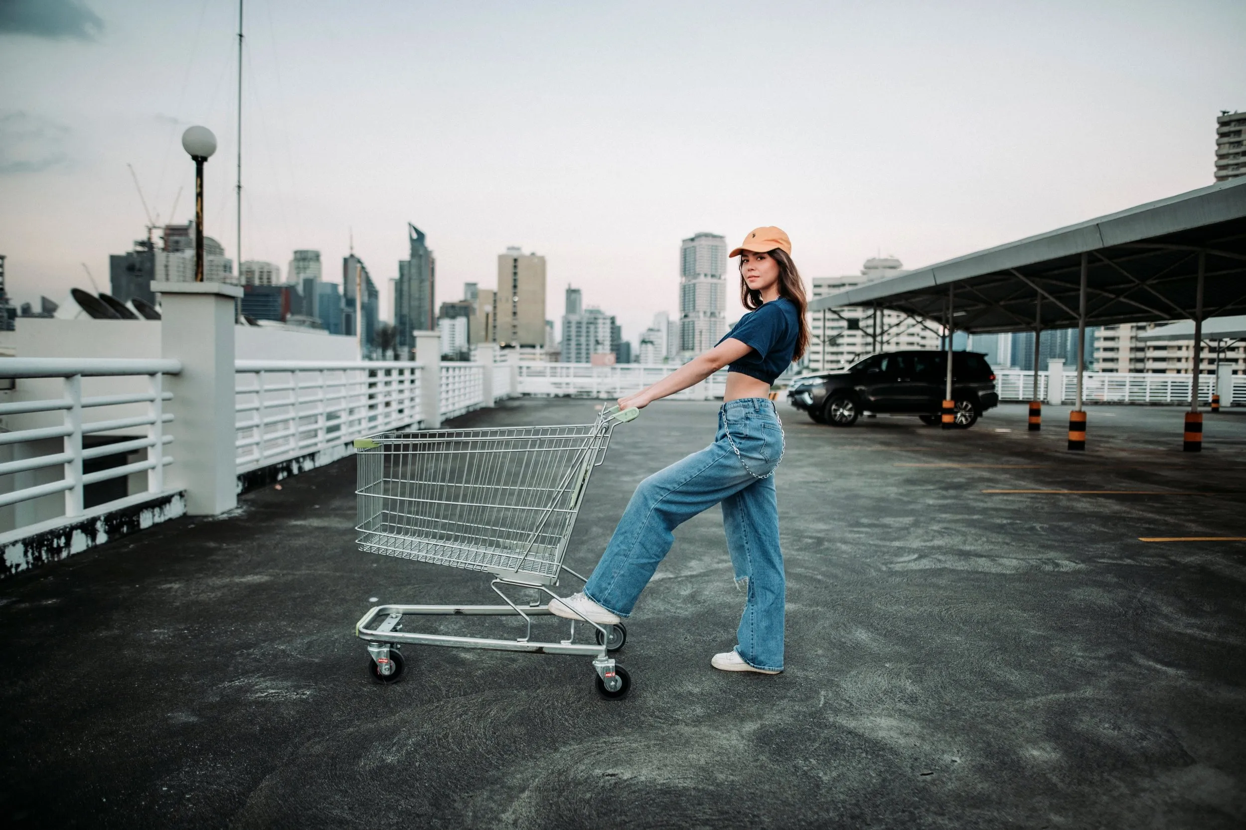 Girl pushing a shopping cart