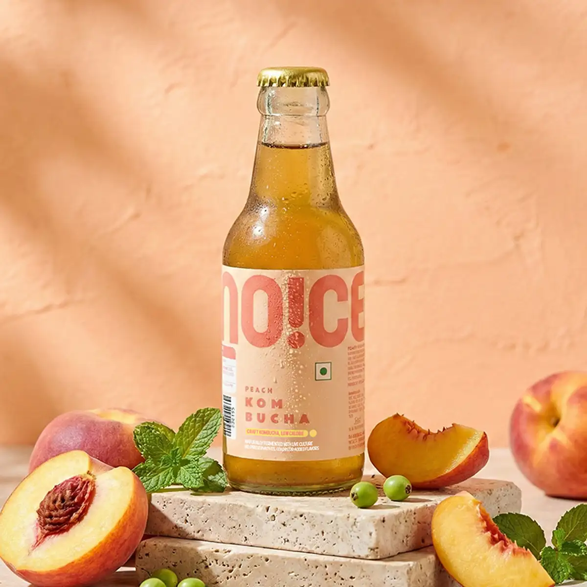 NOICE Peach Kombucha slow fermented in small batches with real peach flavor and no added preservatives.